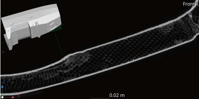 圖像展示了使用工業(yè)CT對蜂窩結(jié)構(gòu)復(fù)合材料組件的內(nèi)部掃描結(jié)果，可清晰觀察到材料內(nèi)部均勻性與潛在結(jié)構(gòu)異常，輔助實現(xiàn)高精度質(zhì)量評估與缺陷識別。